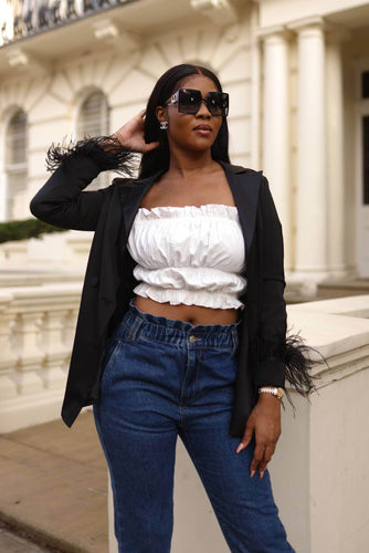 The White Ruffle Crop Top is the perfect crop top with gathered bust. Featuring off-shoulder, ruffle hem and long elastic puffy sleeves. This top is everything you need for any occasion.